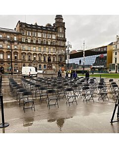 Profile view of Black Economy Plastic Folding Chair