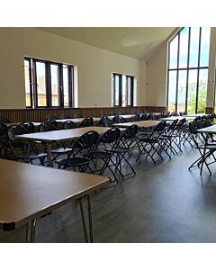 Profile view of Black Economy Fanback Plastic Folding Chair