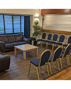 Profile view of Round Back Aluminium Banqueting Chair in Blue Fabric
