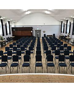 Profile view of Diamond Steel Banqueting Chair in Blue Fabric