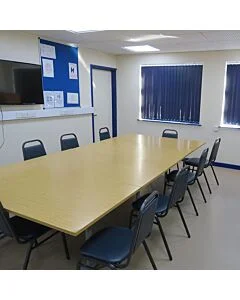 Profile view of Economy Steel Banqueting Chair in Blue Vinyl Fabric