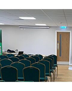 Profile view of Diamond Steel Banqueting Chair in Green Fabric