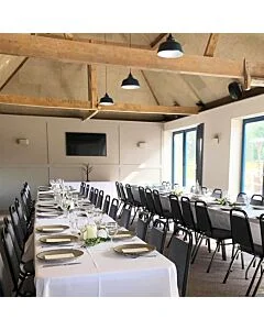 Profile view of Economy Steel Banqueting Chair in Grey Fabric