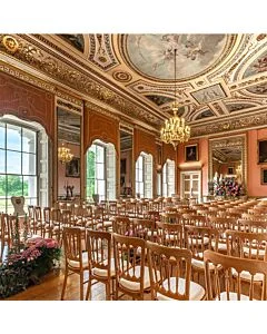 Profile view of Natural Cheltenham Banqueting Chair with Red Seat Pad