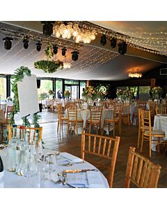 Profile view of Natural Chiavari Banqueting Chair with Light Grey Seat Pad