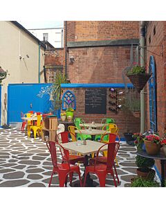 Profile view of Red Tolix Side Chair