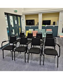 Profile view of Economy Steel Banqueting Chair with Arms in Black Fabric