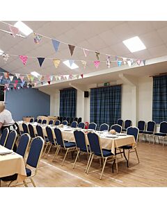 Profile view of Diamond Steel Banqueting Chair in Blue Fabric