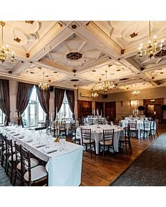 Profile view of Walnut Chiavari Banqueting Chair with Purple Seat Pad