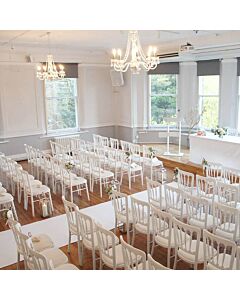 Profile view of White Cheltenham Banqueting Chair with Ivory Seat Pad