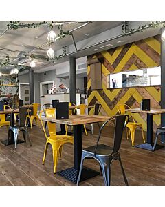 Profile view of Yellow Tolix Side Chair