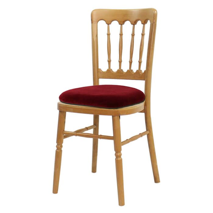 Profile view of Natural Cheltenham Banqueting Chair with Red Seat Pad