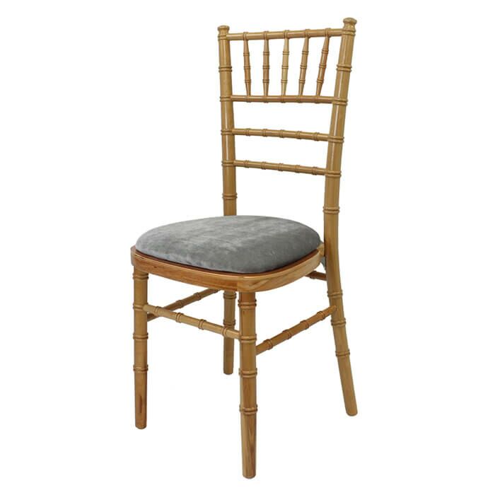 Profile view of Natural Chiavari Banqueting Chair with Light Grey Seat Pad