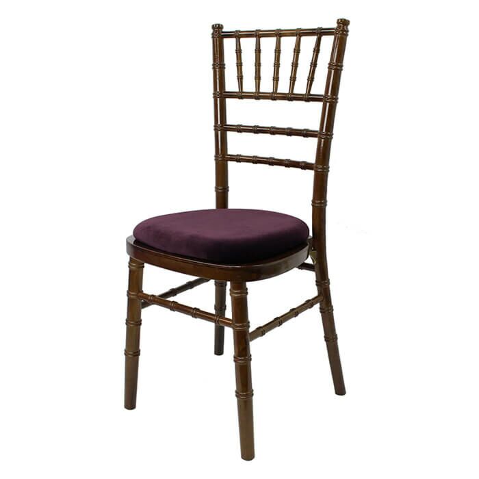 Profile view of Walnut Chiavari Banqueting Chair with Purple Seat Pad