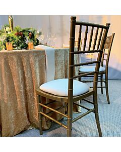 Profile View of Antique Gold Resin Chiavari Banqueting Chair with Ivory Seat Pad